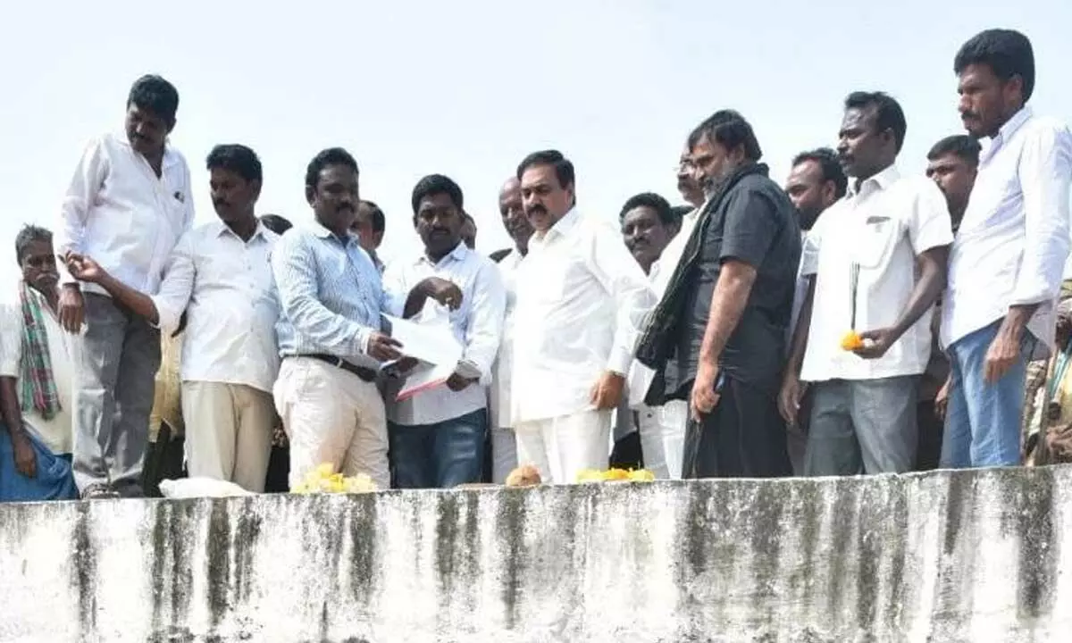 Agriculture Minister Kakani Govardhan Reddy observing the link canal between Kanupuru and Idimepalli tank on Sunday