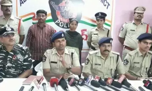 SP Satish Kumar producing the surrendered Maoists before the media at Yetapaka police station on Sunday