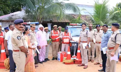 Superintendent of Police Y Rishanth Reddy distributing traffic kits to drivers of road safety mobile vehicles at a programme in Chittoor on Sunday