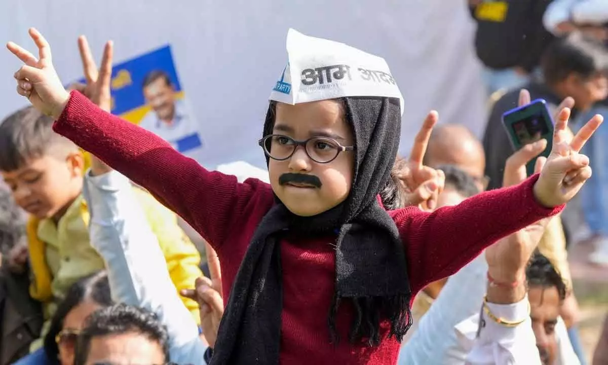 A child dressed as Delhi Chief Minister Arvind Kejriwal takes part in the celebrations of AAPs victory in the MCD polls, in New Delhi on Wednesday. AAP crossed the majority mark in the MCD polls.
