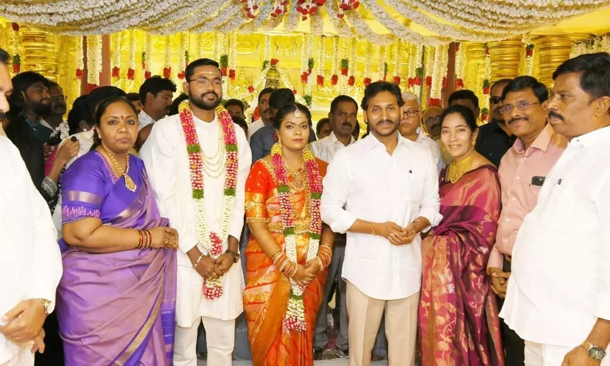 Chief Minister Y S Jagan Mohan Reddy blessing the couple Sowjanya and Dr Sravan Kumar at VPR Convention Hall in Nellore on Wednesday