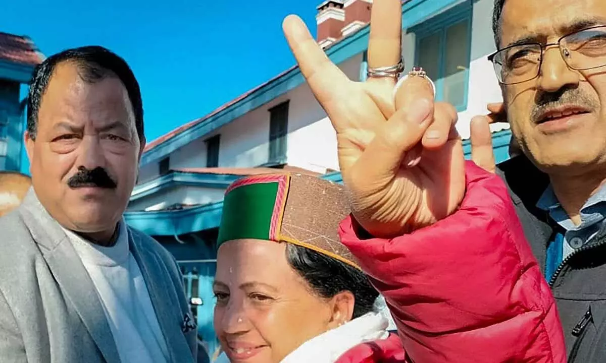Himachal Congress president Pratibha Singh flashes victory sign as she celebrates the partys victory in State Assembly elections, in Shimla on Thursday