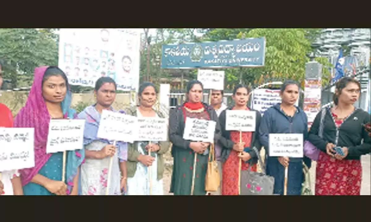 Transgender persons stage protest at the entrance of Kakatiya University (KU) campus in Warangal, on Friday