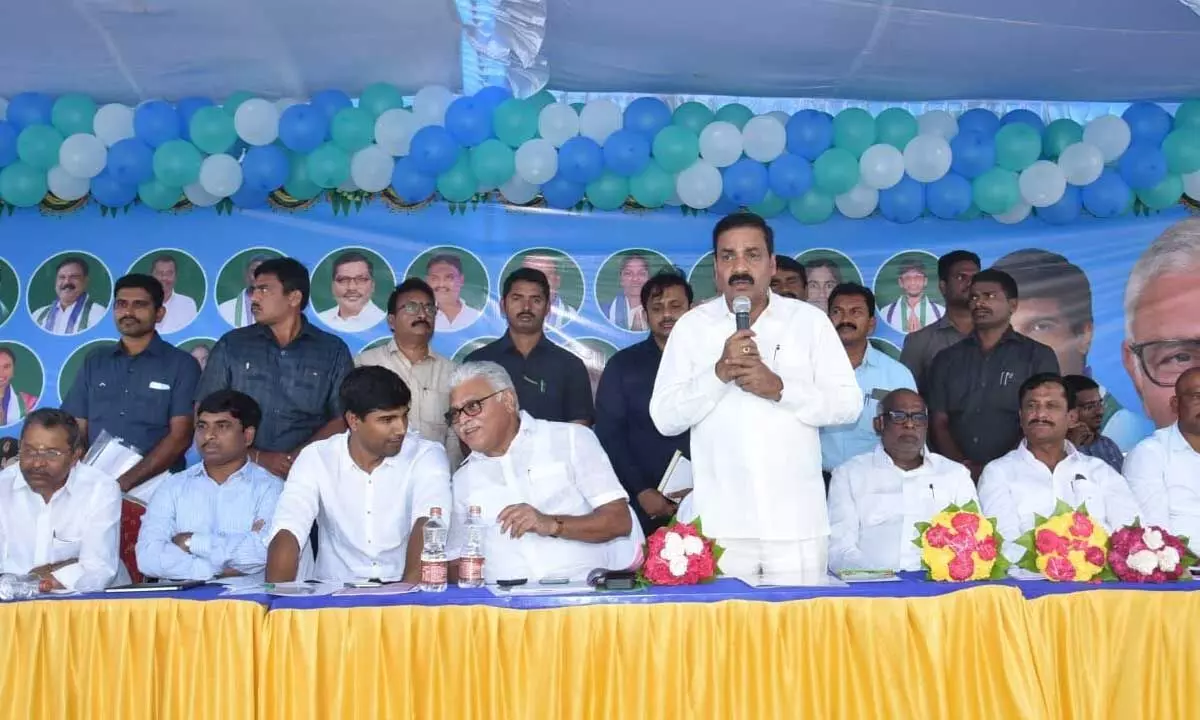 Agriculture Minister Kakani Govardhan Reddy addressing a meeting held at Dhulipala village on Sunday. Minister Ambati Rambabu is also seen.