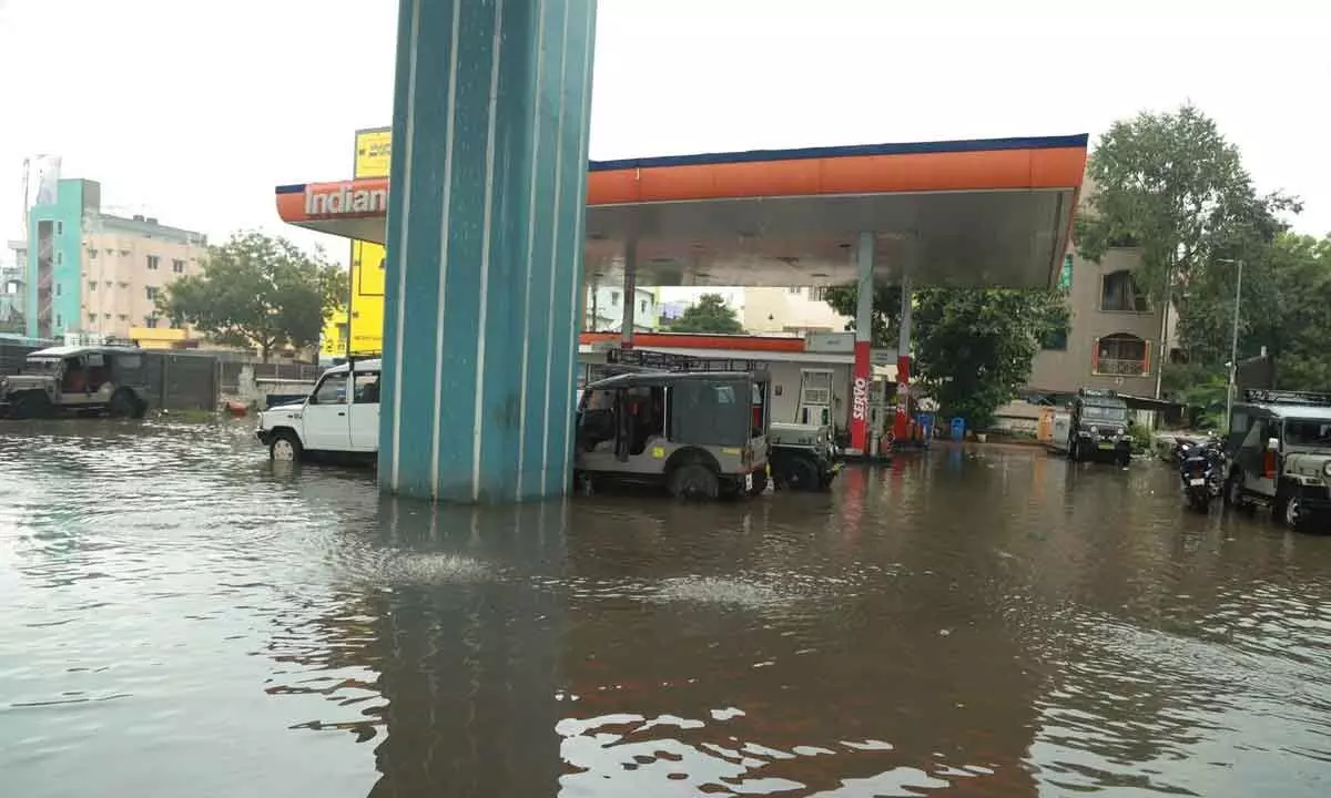 A petrol bunk at Leela Mahal junction waterlogged with rainwater in Tirupati on Monday