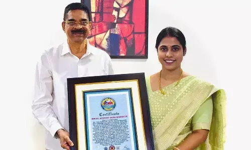 Governor of Mizoram K Haribabu presenting the award to Ooha Mahanthi in Visakhapatnam on Tuesday