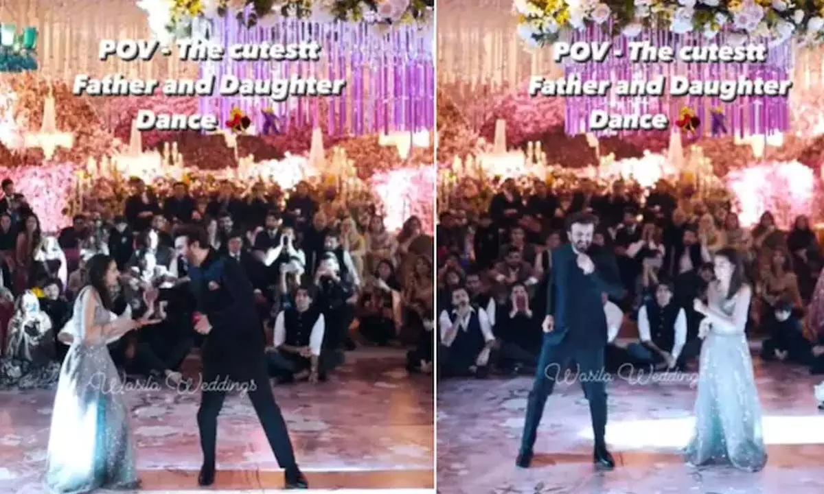 A Father-Daughter Dancing Together With Their Perfect Moves