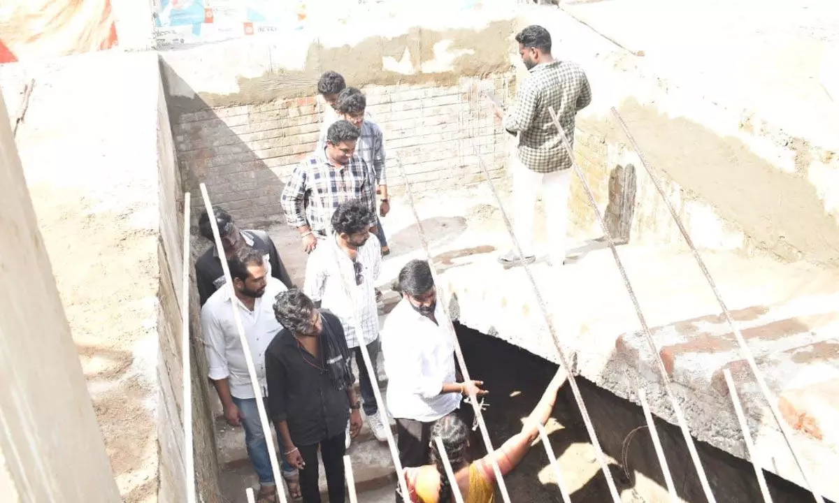 Jana Sena leaders observing damaged school structure at ZP High School in Nellore on Wednesday