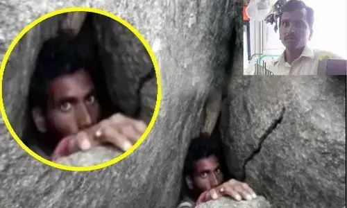 Visuals of Raju stuck between the rocks