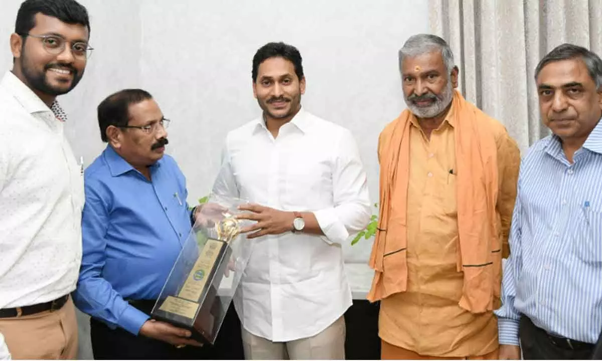 Special Chief Secretary (Energy) K Vijayanand showing the National Energy Conservation Award-2022 to Chief Minister Y S Jagan Mohan Reddy at the latter’s camp office in Tadepalli on Friday.  Energy Minister Peddireddi Ramachandra Reddy and other senior officials are also seen.