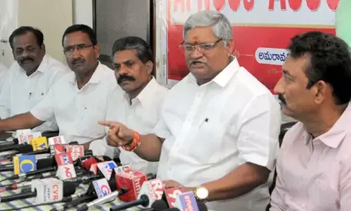APNGO Association State president Bandi Srinivasa Rao addressing a press conference at NGO Home in Vijayawada on Friday. General secretary K Sivareddy is also seen. 					Photo: Ch Venkata Mastan