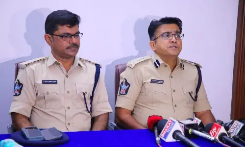 Guntur Range DIG CM Trivikrama Varma addressing the media in Guntur on Sunday. Palnadu district SP Ravishankar Reddy is also seen.