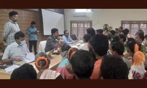 Joint Collector Siva Srinivas and others receiving petitions from people at Spandana programme in Rampachodavaram on Monday