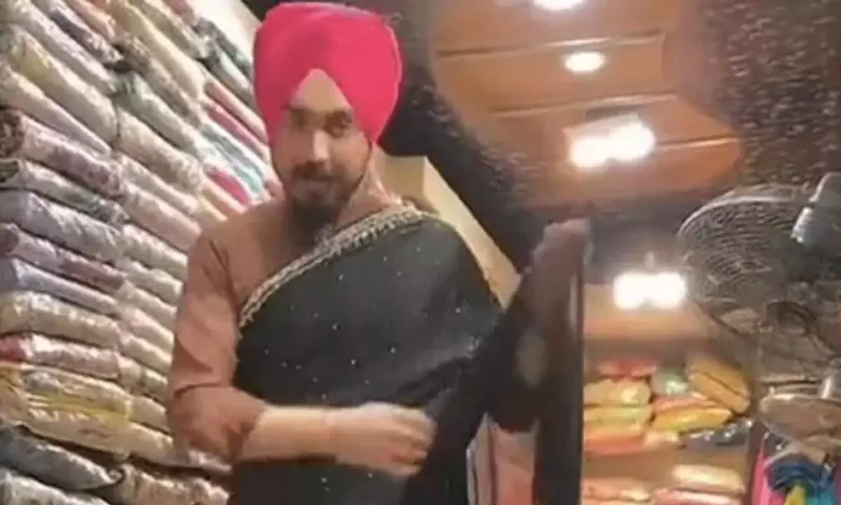 Watch The Trending Video Of Man Draping Saree At A Store