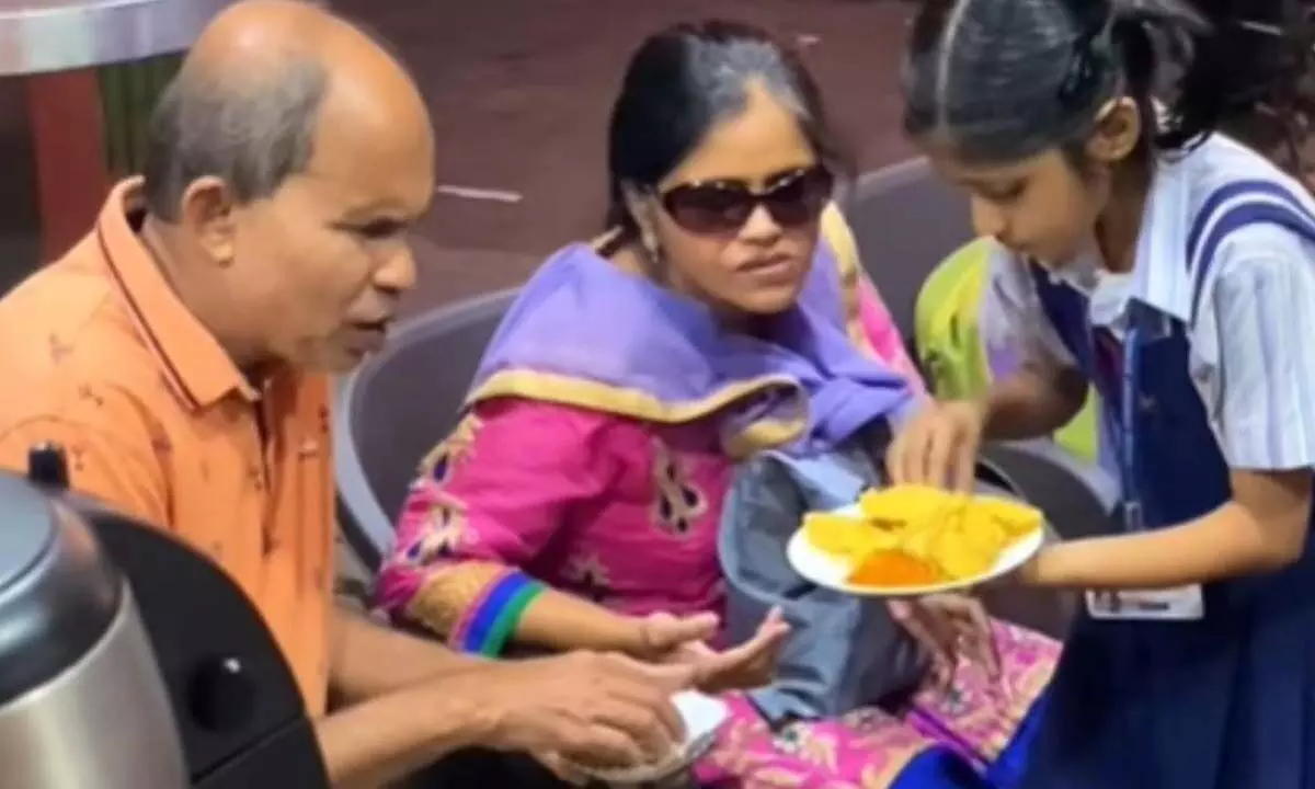 Watch The Trending Video Of School-Going Daughter Taking Care Of Visually-Impaired Parents