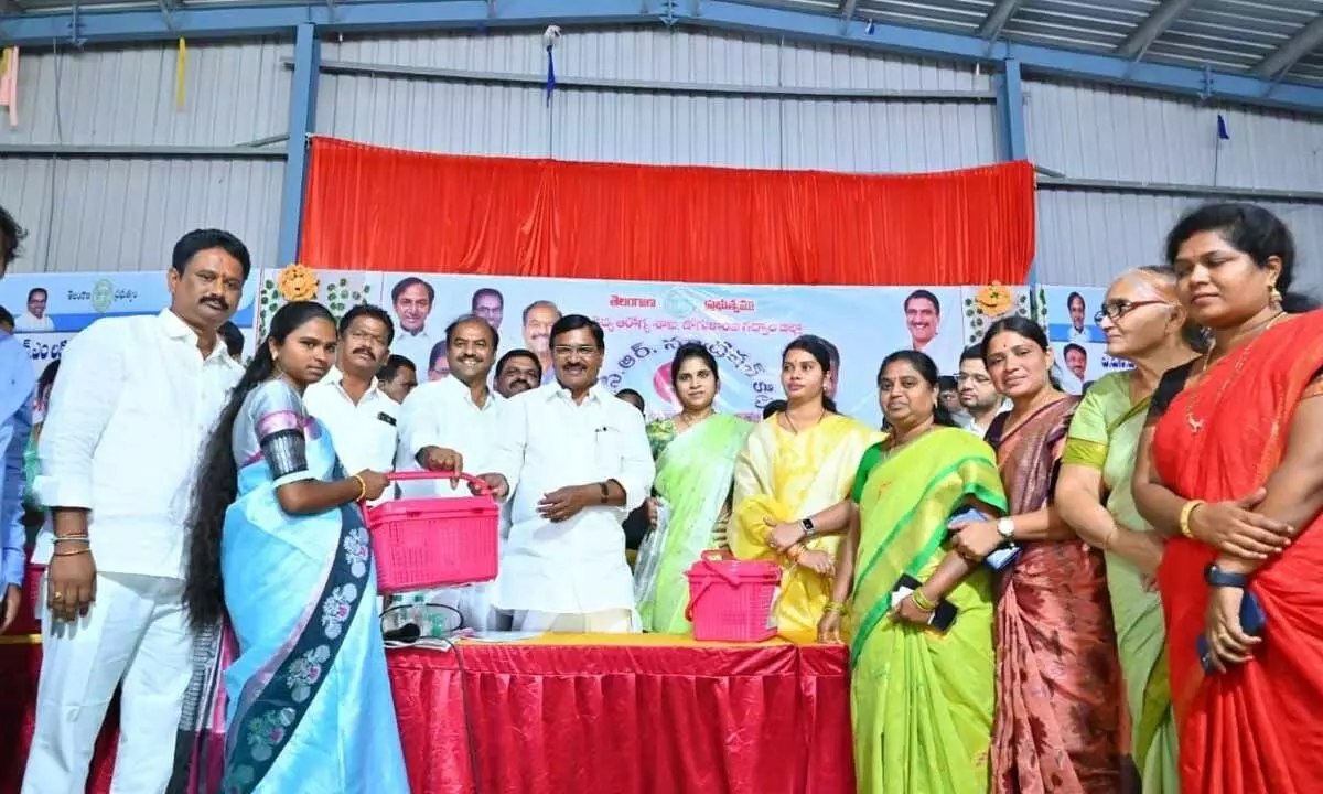 Minister for Agriculture Singireddiy Niranjan Reddy distributing kcr nutrition kits to pregnant women in gadwal on wednesday