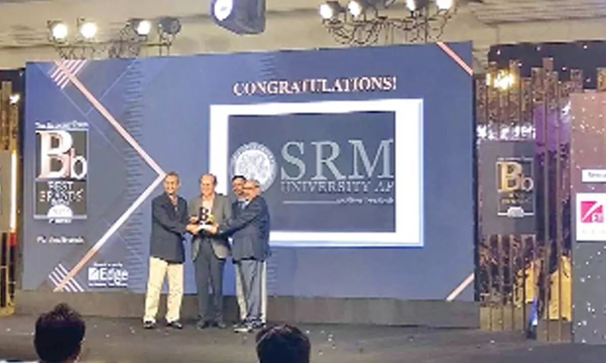 Registrar Premkumar, Dean of Paari School of Business Prof Bharadhwaj Sivakumaran, and Director of Communications of SRM-AP receiving the Best Brand award in Mumbai on Wednesday