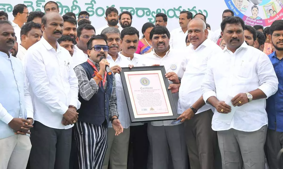 A representative of Genius Book of Records Virendra handing over the certificate to the party leaders at YSRCP  central office in Tadepalli on Wednesday