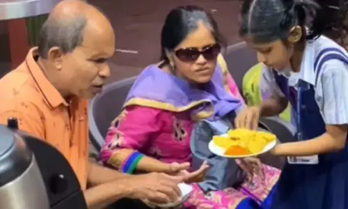 Watch The Trending Video Of School-Going Daughter Taking Care Of Visually-Impaired Parents