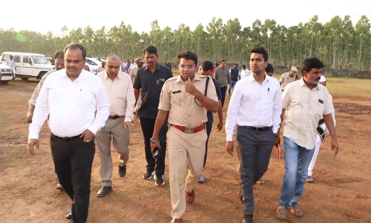 District Collector Anudeep Durishetty and SP Dr G Vineeth inspecting arrangements at the helipad on BPL School premises in Sarapaka on Monday.