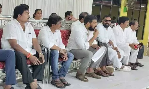 MLA Dr P Anil Kumar Yadav interacting with the staff members of ward sachivalayam on pensions issue in Nellore on Monday
