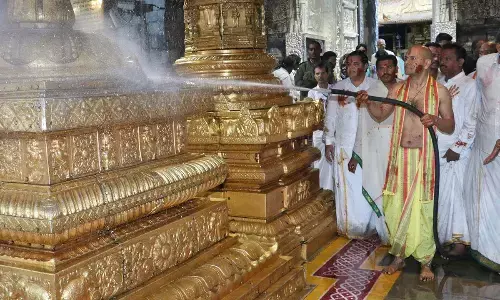 TTD executive officer A K Singhal cleaning Vendi Vakili (area) and also Vimana Prakaram, Dwaja Sthambham in Tirumala temple as part of Koil Alwar Tirumanjanam on Tuesday