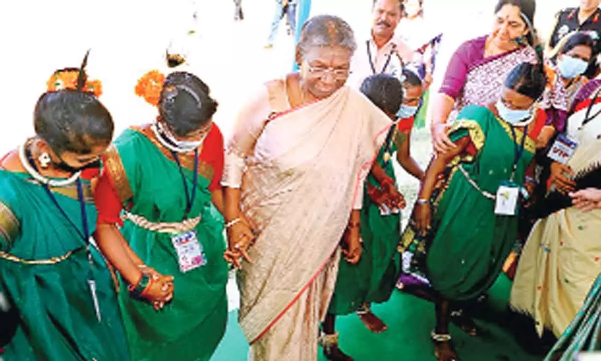 President Droupadi Murmu joins Tribals during an impromptu dance during the inauguration of Sammakka Saralamma Janjathi Pujari Sammellan in Bhadrachalam on Wednesday