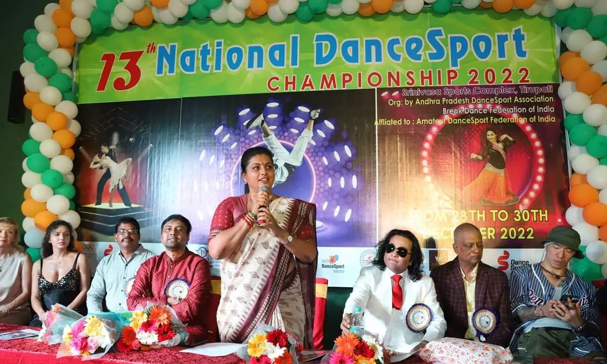 Minister for Tourism and Culture R K Roja speaking at the inaugural function of 13th National Dancesport Championship in Tirupati on Wednesday. SETVEN CEO  Dr V Muralikrishna, Jalli Madhusudan, Aravind Kumar and others are seen.