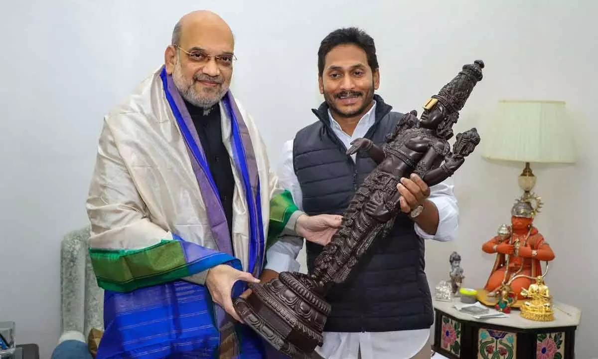 Chief Minister YS Jagan Mohan Reddy presents a memento to Union Home Minister Amit Shah, in New Delhi on Thursday