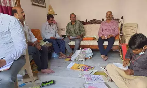 ACB officials carry out searches at the residence of motor vehicle inspector E Mrutyunjaya Raju in Vijayawada on Thursday.