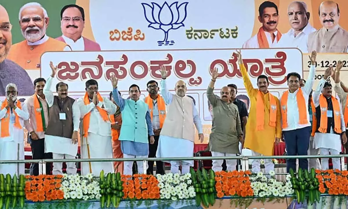 Union Home Minister Amit Shah with Karnataka Chief Minister Basavaraj Bommai and others during a public meeting in Mandya on Friday