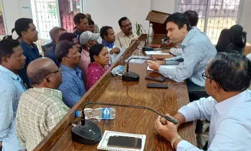 District Collector Sumeet Kumar interacting with the petitioners during Spandana programme at Paderu ITDA on Friday