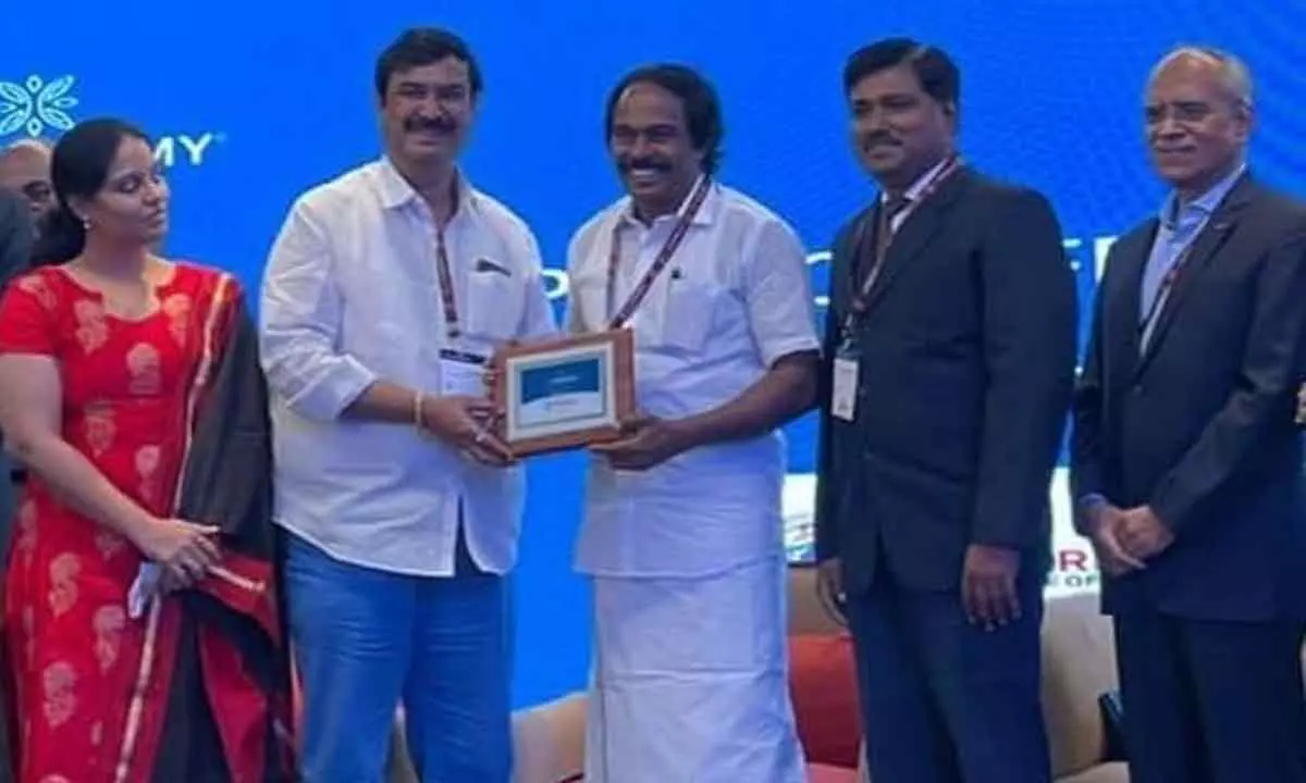 SBIT chairman G Krishna receiving memento from IT Minister of Tamil Nadu during the programme at Hyderabad.