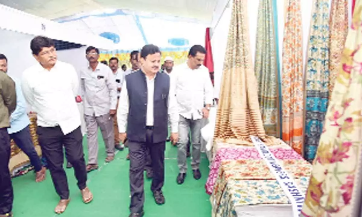 District Collector K Venkataramana Reddy going through the State Handloom Expo at Shilparamam in Tirupati on Monday