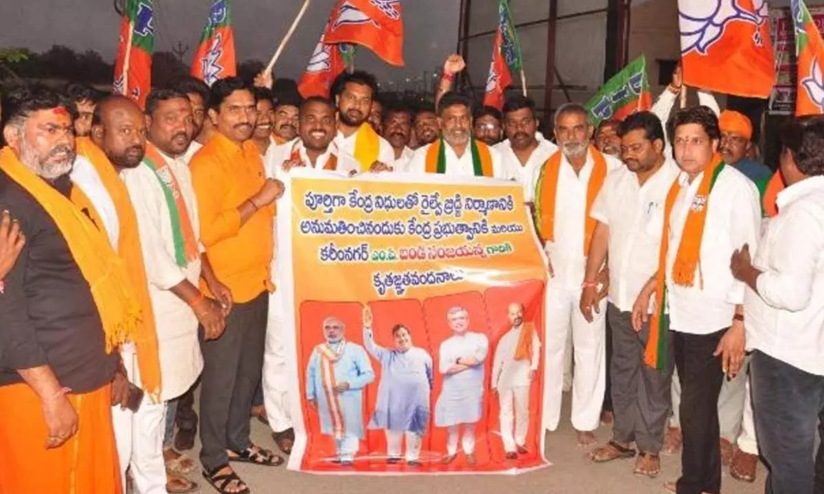 BJP ranks celebrate after Central government approved construction of Road over Bridge at Thigalaguttapalli LC No.18 in Karimnagar town