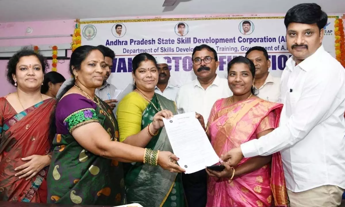 Mayor G Hari Venkata Kumari and Advisor to AP government (Skill and Job Fair) G Sridhar Reddy handing over certificates to the youth in Visakhapatnam on Wednesday