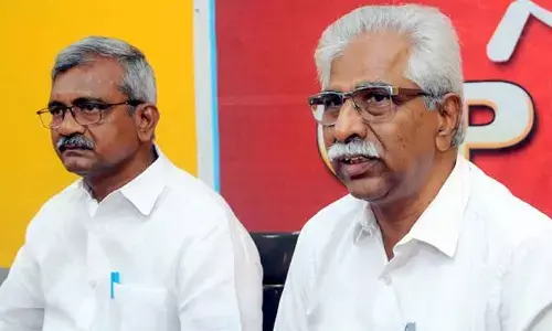 CPM state secretary V SrinivasaRao and executive member Ch Babu Rao addressing a press conference in Vijayawada on Thursday  	Hans photo Ch Venkata Mastan