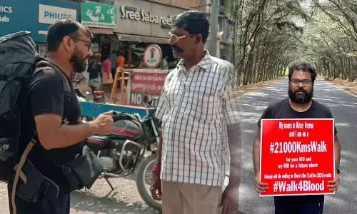 Kiran Verma interacting with a person on blood donation; Kiran Verma on a mission to walk 21,000-km to build awareness about blood donation