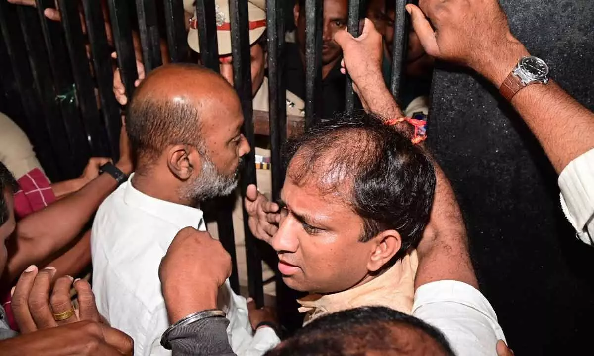 BJP president Bandi Sanjay Kumar and Congress leader Mohd Ali Shabbir being detained by police in Kamareddy on Friday
