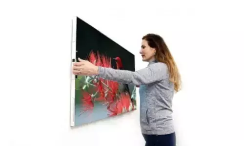 This wireless TV sans remote sticks to wall without a mount