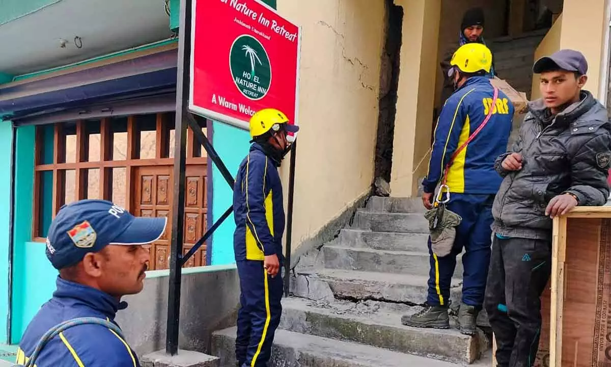 SDRF personnel at a hotel after cracks appeared due to the gradual sinking of Joshimath in Chamoli district of Uttarakhand, Monday