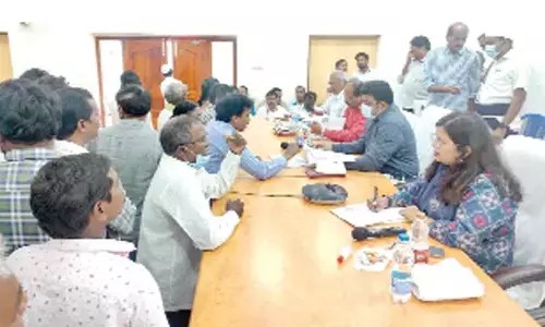 Krishna District Collector P Ranjith Basha and Joint Collector Aparajitha Singh receiving petitions from public in Machilipatnam on Monday