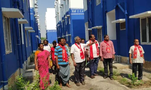 CPM leader Ch Babu Rao and other leaders visiting TIDCO houses at Tallayapalem on Wednesday