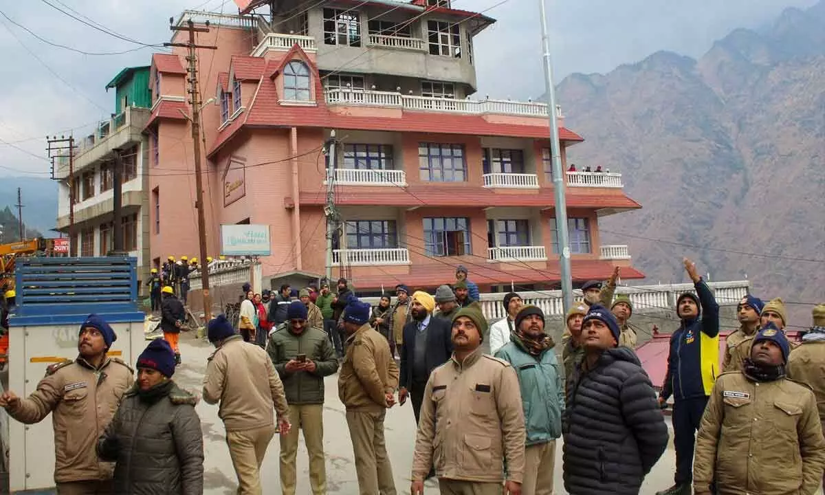 Police personnel deployed outside Hotel Malari Inn ahead of its demolition, in Joshimath on Thursday