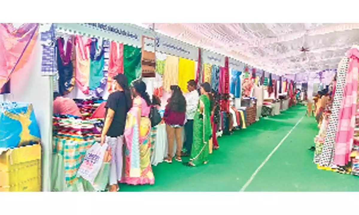 Visitors looking at the handloom works at the expo at Shilparamam in Tirupati