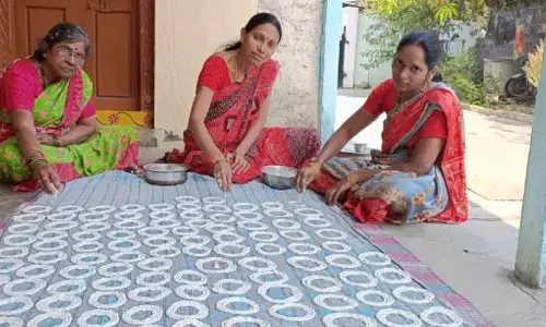 A woman preparing Telanganas favourite tasty Sakinala in Karimnagar.