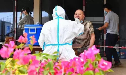 Covid cases in China touch 900 million