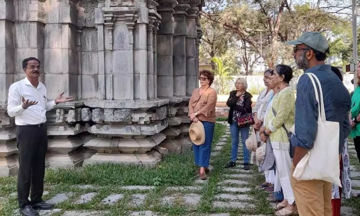 Archeology expert Dr Shiva Nagi Reddy explaining the history and significance of sculptures at the Pacchala Someshwralayam located at Panagal in Nalgonda, on Monday