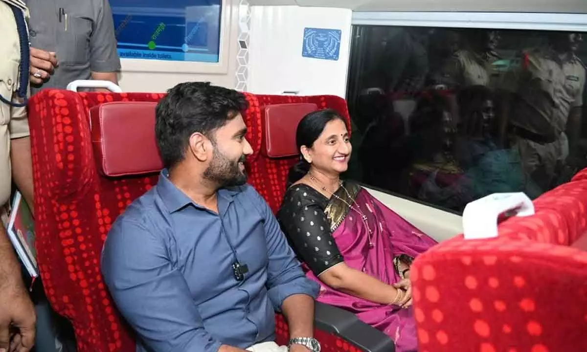 MP Bharat Ram and District Collector Dr K Madhavi Latha inspecting the facilities in the chair car of Vande Bharat train at Rajahmundry railway station on Sunday night