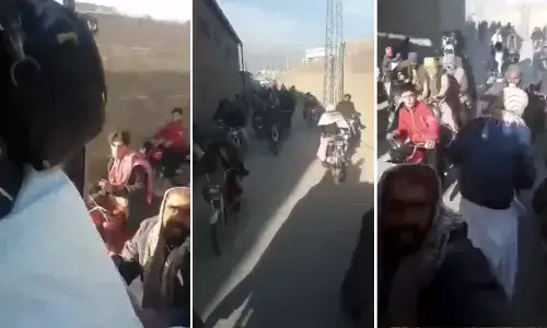 People On Bike Chasing Truck Carrying Wheat
